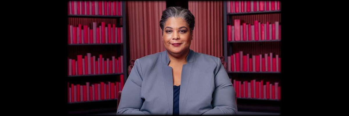 Pictured: Roxane Gay in front of a book shelf